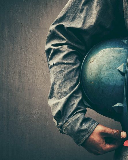 Man holding blue helmet close up